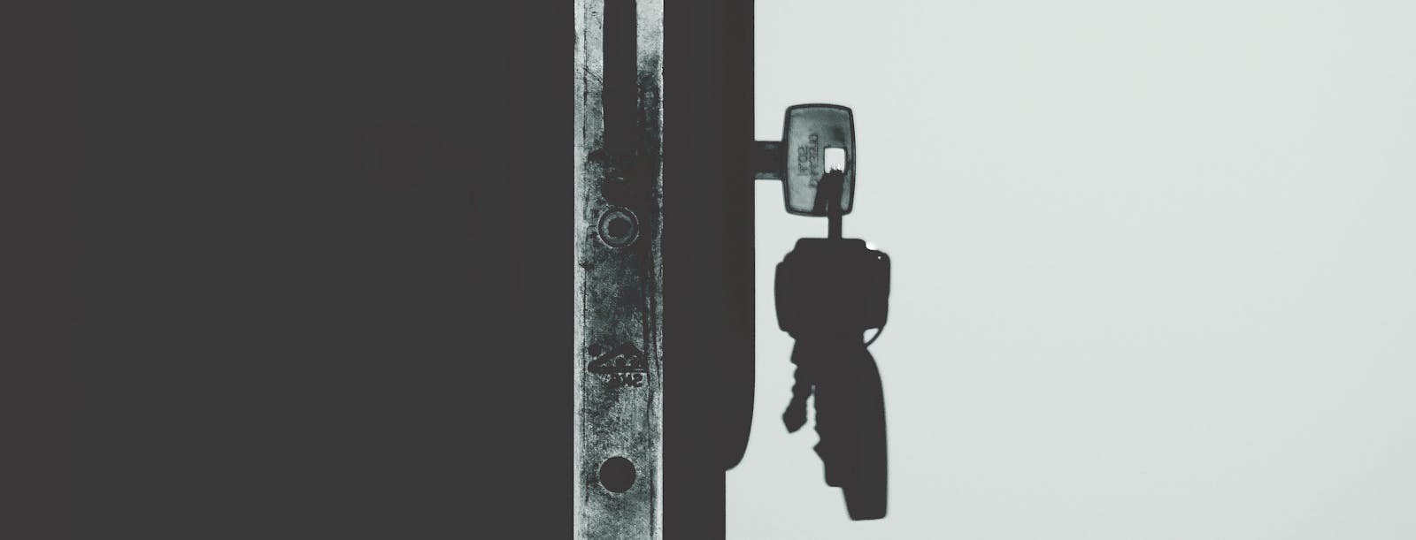 A set of keys hanging in a residential front-door lock